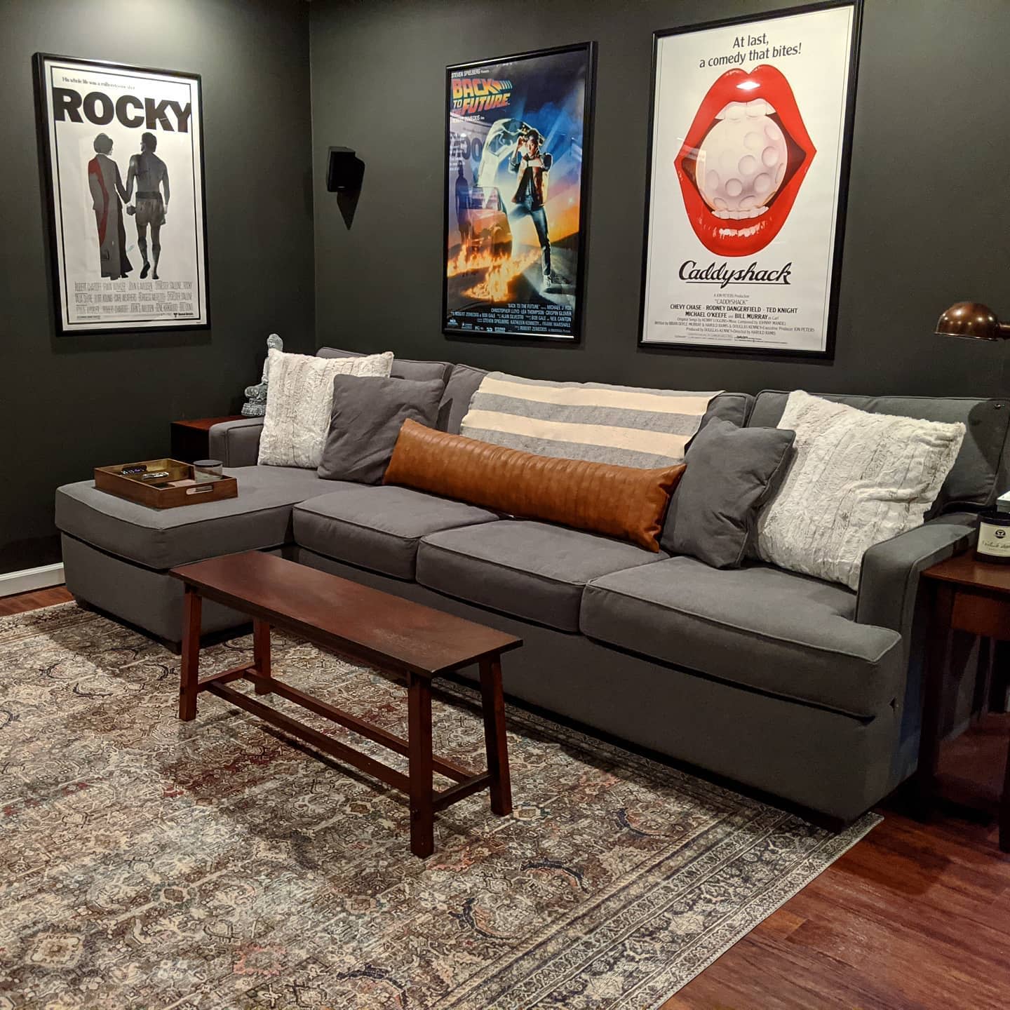 lounge room with movie poster artwork